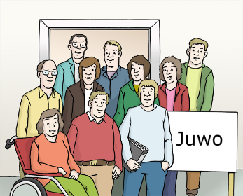 Mitarbeiter*innen stehen zusammen in einer Gruppe, eine Person im Rollstuhl